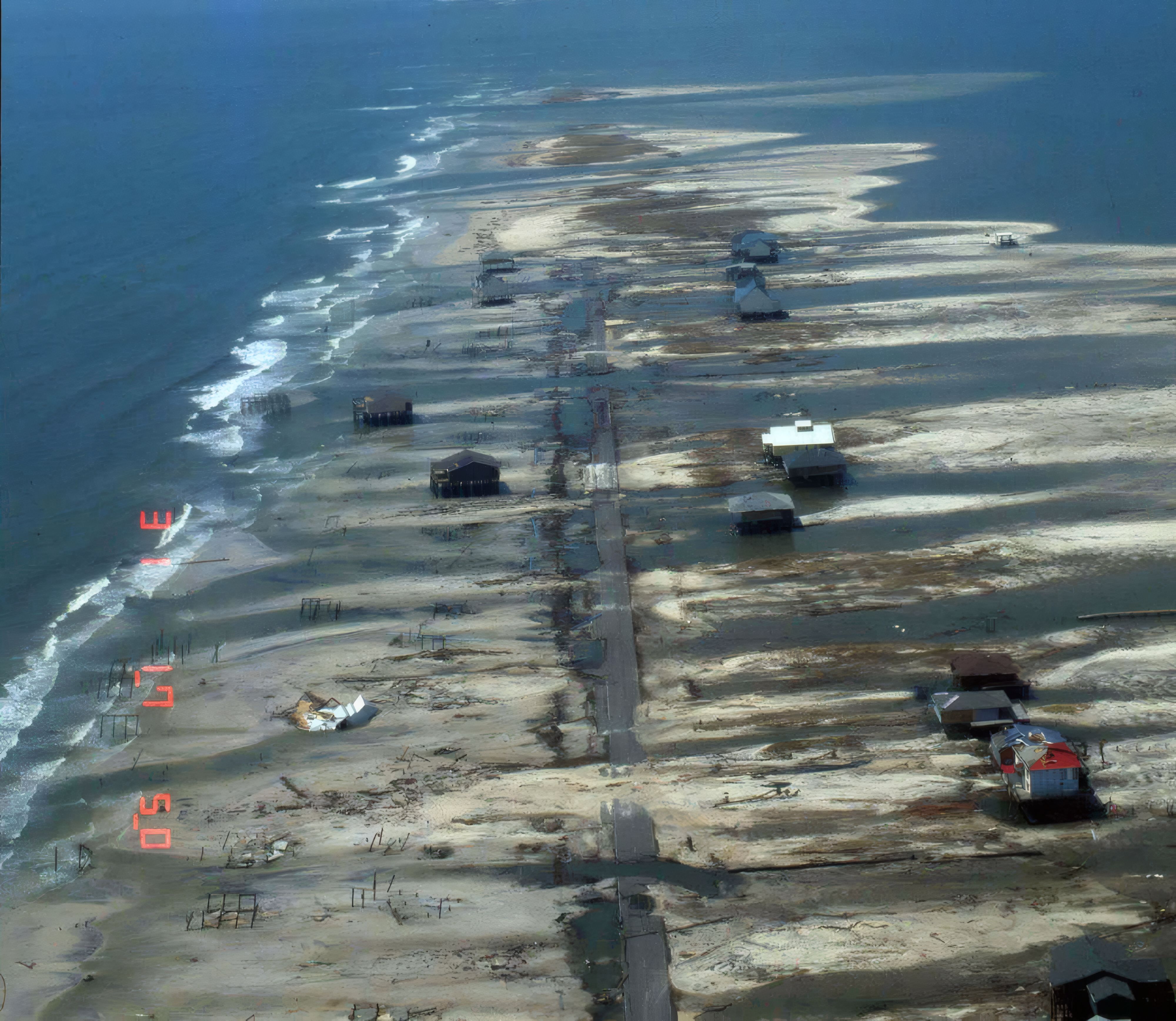 Dramatic shoreline erosion and large overwash deposits along Dauphin Island during Hurricane Katrina (29/8/2005) demonstrate classic barrier island rollover (